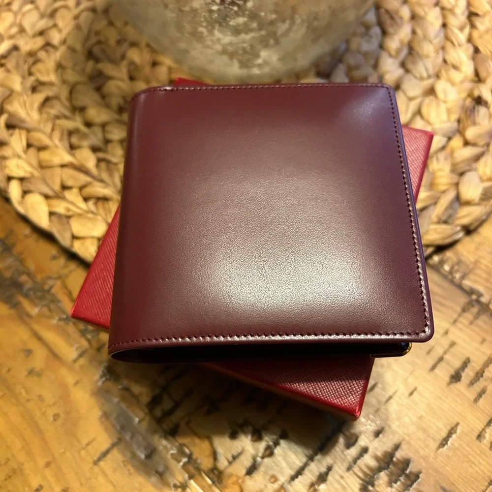 Cartier Deep Burgundy Leather bifold Gold Corner Hardware
